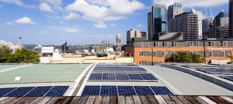 City scene with solar panels on factory roof